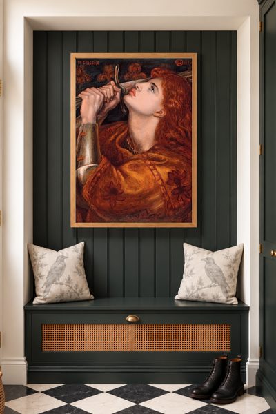 Joan of Arc by Dante Gabriel Rossetti as a framed print in a hallway