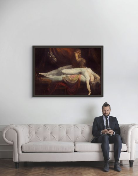 The Nightmare by Henry Fuseli as a framed print in a living room